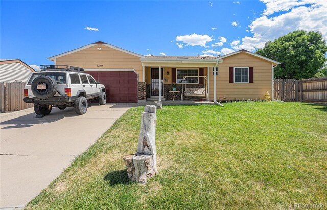 12244 Clermont Ct, Thornton, CO 80241 - ranch-style house featuring covered porch, driveway, an attached garage, and brick siding