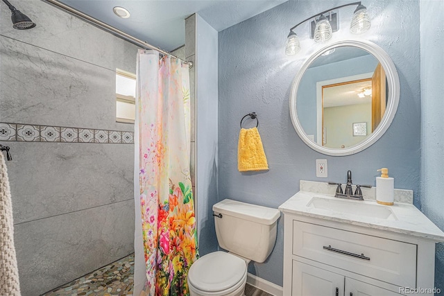 12244 Clermont Ct, Thornton, CO 80241 - full bathroom featuring vanity and tiled shower