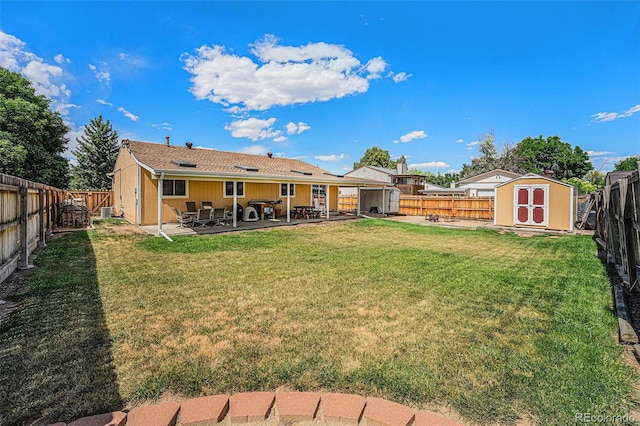 12244 Clermont Ct, Thornton, CO 80241 - fenced backyard featuring a storage shed and a patio area