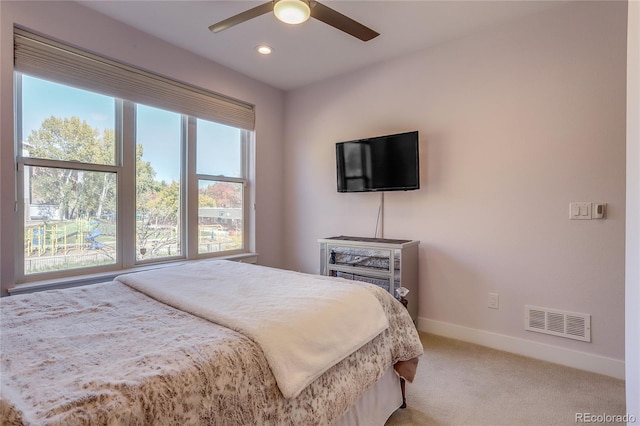 carpeted bedroom with ceiling fan