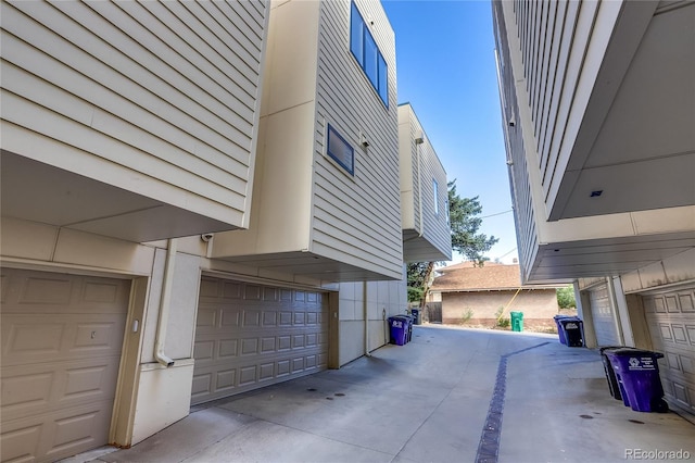 view of side of home featuring a garage