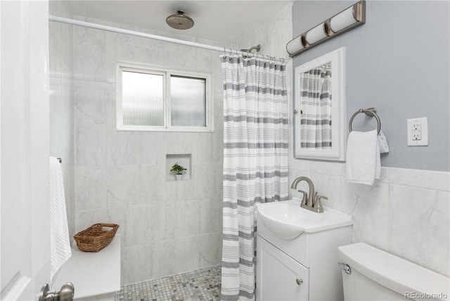 8240 Grandview Ave, Arvada, CO 80002 - full bathroom with tiled shower, vanity, toilet, and tile walls