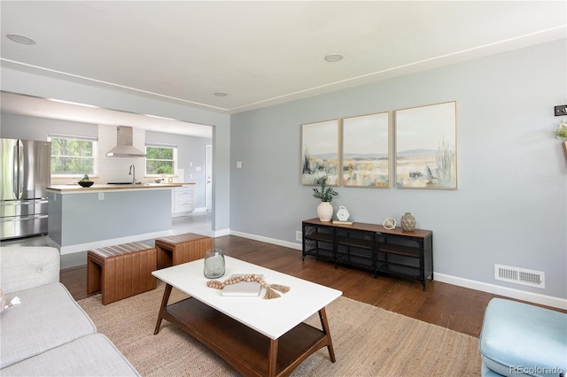 8240 Grandview Ave, Arvada, CO 80002 - living area featuring wood finished floors and baseboards