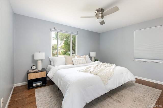 8240 Grandview Ave, Arvada, CO 80002 - bedroom with baseboards, dark wood-style flooring, and a ceiling fan