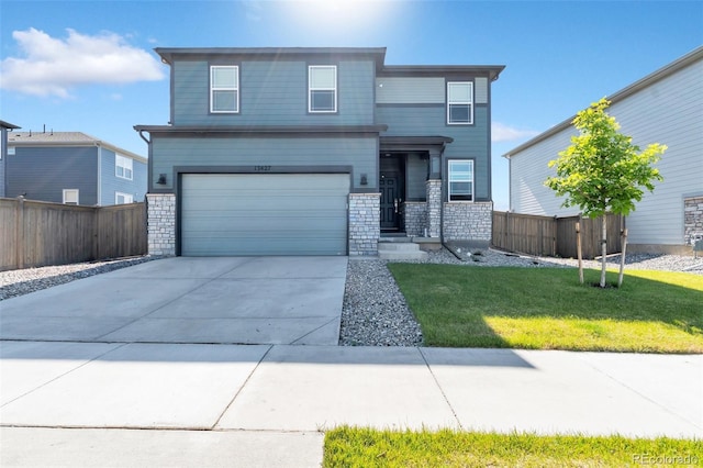 view of front facade with a garage and a front lawn