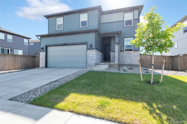 view of front facade featuring a garage and a front yard