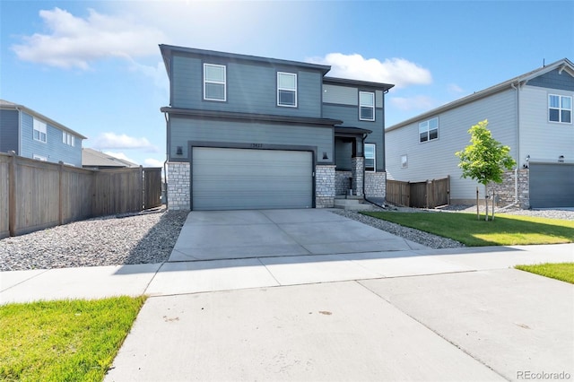 view of front of home featuring a garage and a front yard