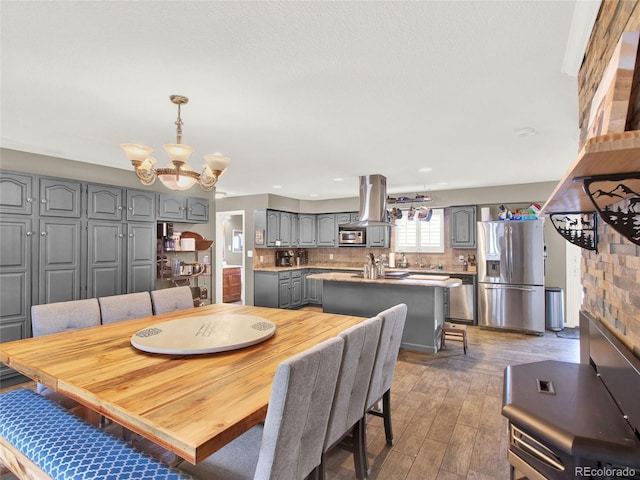 dining room featuring a notable chandelier and wood finished floors