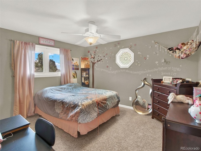 carpeted bedroom featuring baseboards and a ceiling fan