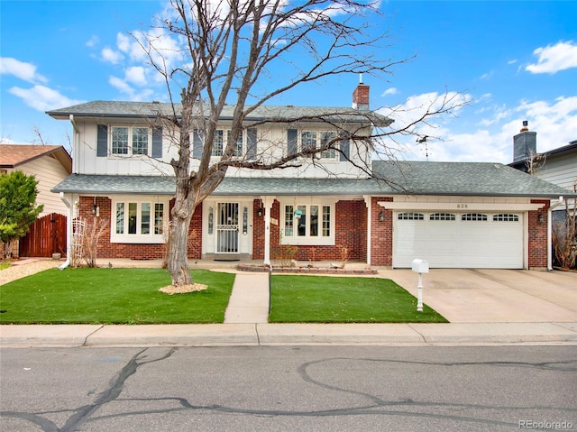 traditional home with a front lawn, fence, driveway, and an attached garage