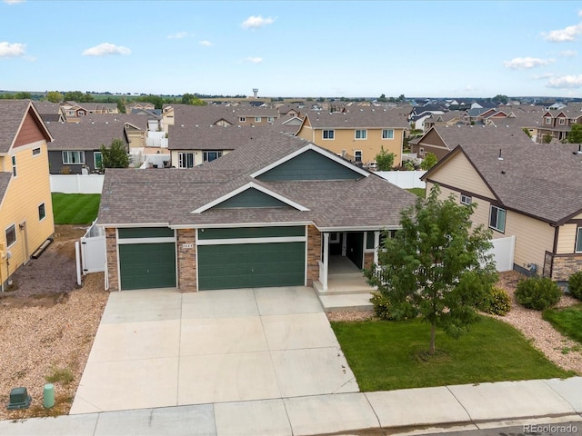 view of front facade with a front yard and a garage