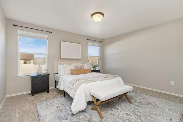 bedroom featuring carpet flooring and multiple windows