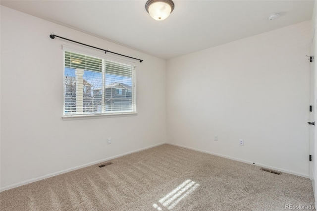 unfurnished room with carpet floors