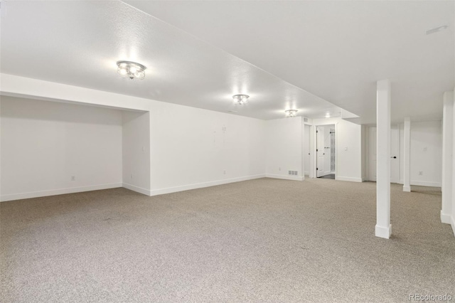 basement with light colored carpet