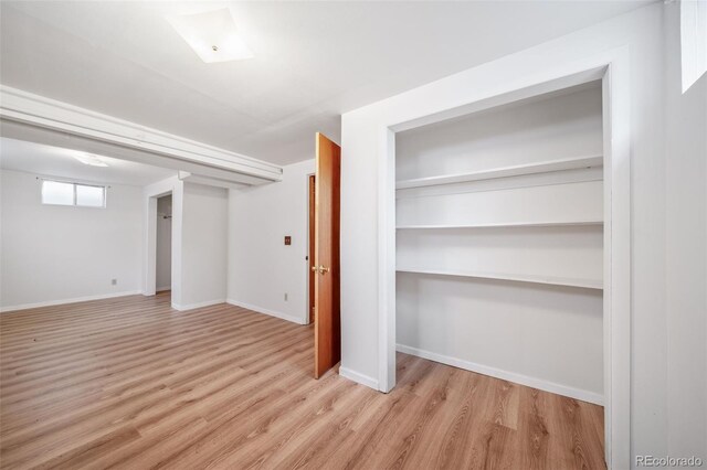 basement featuring light wood-type flooring