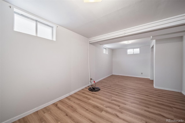 basement featuring light wood-type flooring