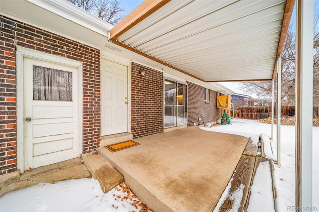 view of snow covered patio