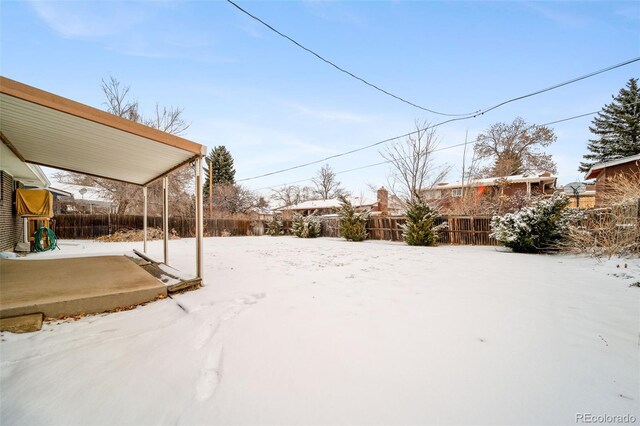 view of yard covered in snow