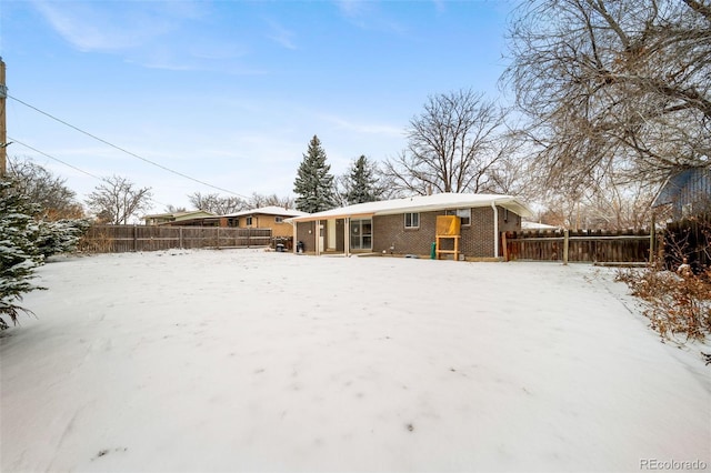 view of snow covered house