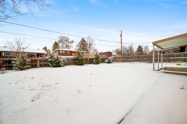 view of yard covered in snow