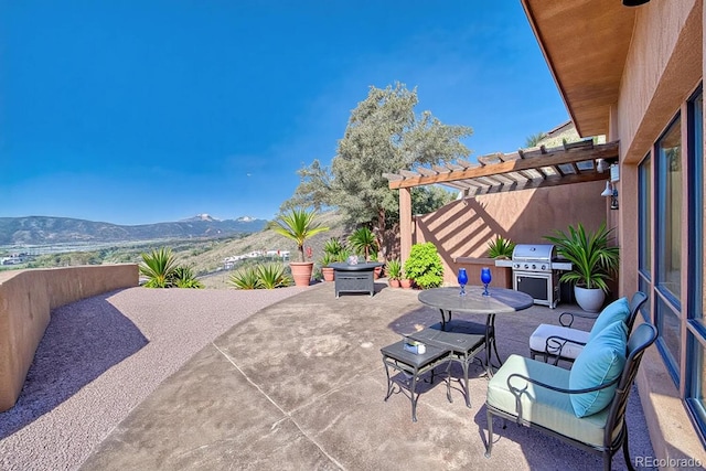 10405 W Cherokee Dr, Salida, CO 81201 - view of patio with a pergola, a mountain view, outdoor dining space, and a grill