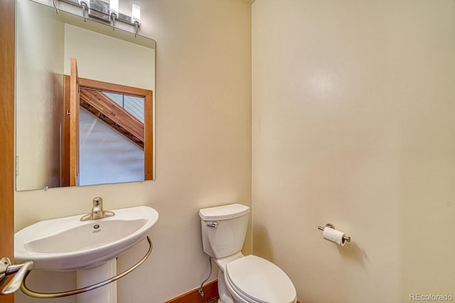 10405 W Cherokee Dr, Salida, CO 81201 - half bath featuring toilet and baseboards