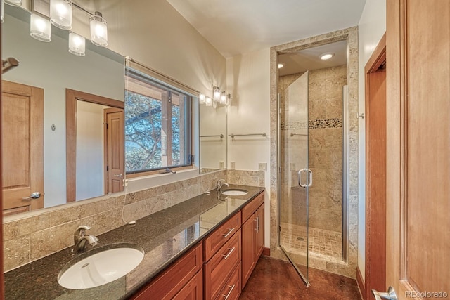 10405 W Cherokee Dr, Salida, CO 81201 - bathroom featuring double vanity, a shower stall, and decorative backsplash