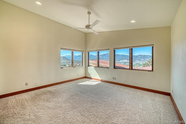 10405 W Cherokee Dr, Salida, CO 81201 - empty room with carpet floors, a ceiling fan, a mountain view, and recessed lighting