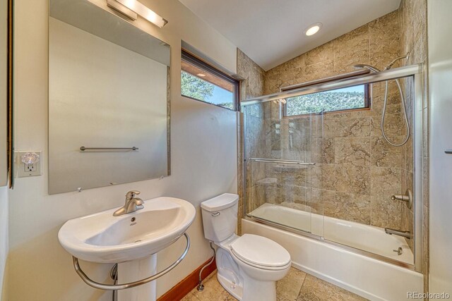 10405 W Cherokee Dr, Salida, CO 81201 - bathroom with plenty of natural light, bath / shower combo with glass door, and recessed lighting
