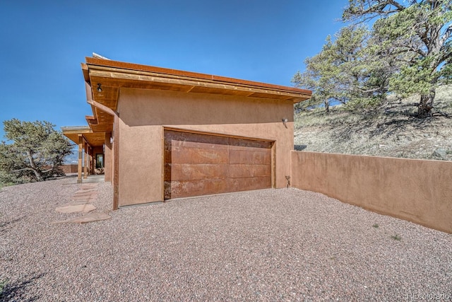 10405 W Cherokee Dr, Salida, CO 81201 - garage featuring gravel driveway