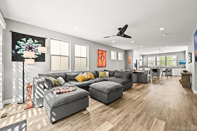 15547 W Vassar Ave, Lakewood, CO 80228 - living room featuring light wood-type flooring, a ceiling fan, and recessed lighting