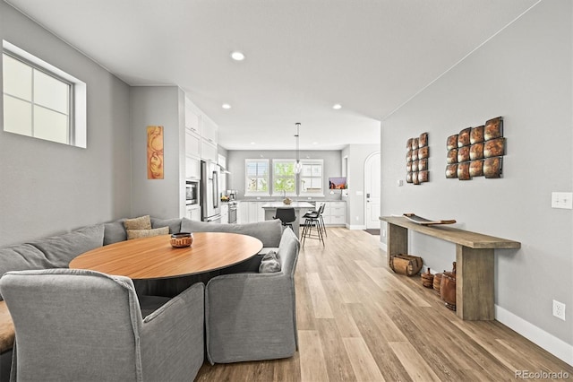 15547 W Vassar Ave, Lakewood, CO 80228 - dining room featuring light wood-style floors and recessed lighting