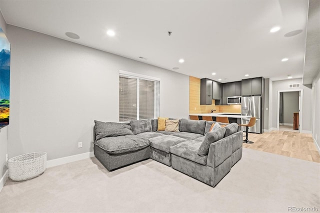 15547 W Vassar Ave, Lakewood, CO 80228 - living room featuring recessed lighting and light wood-type flooring