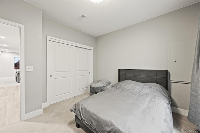 15547 W Vassar Ave, Lakewood, CO 80228 - bedroom with a closet and light carpet