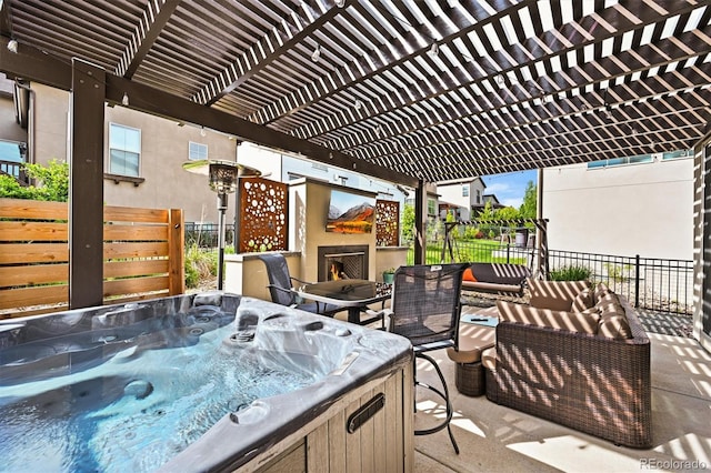 15547 W Vassar Ave, Lakewood, CO 80228 - view of patio featuring a hot tub, a pergola, and an outdoor living space with a fireplace