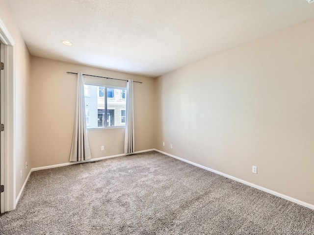 empty room featuring carpet flooring