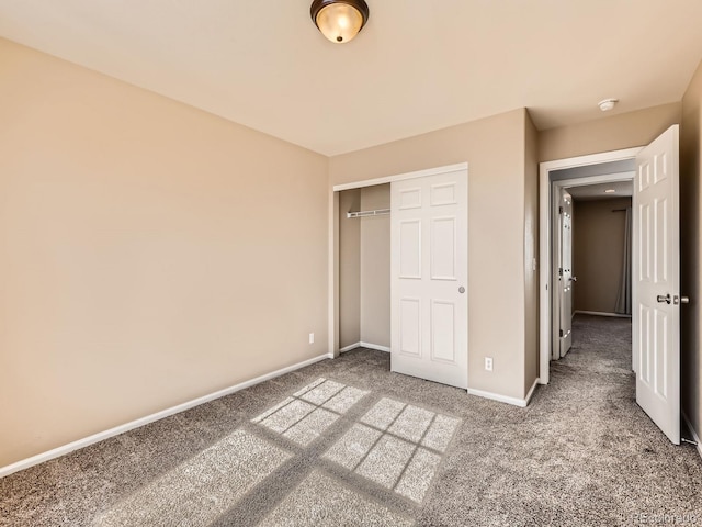 unfurnished bedroom featuring a closet and carpet