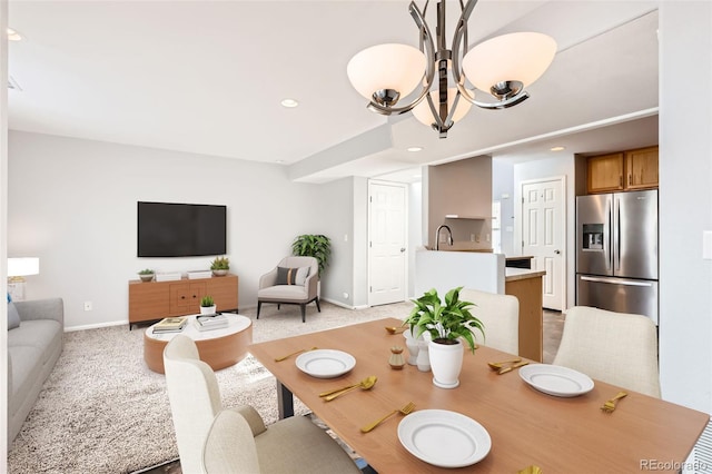 5888 Biscay St Unit D, Denver, CO 80249 - dining room with a chandelier, baseboards, recessed lighting, and light carpet