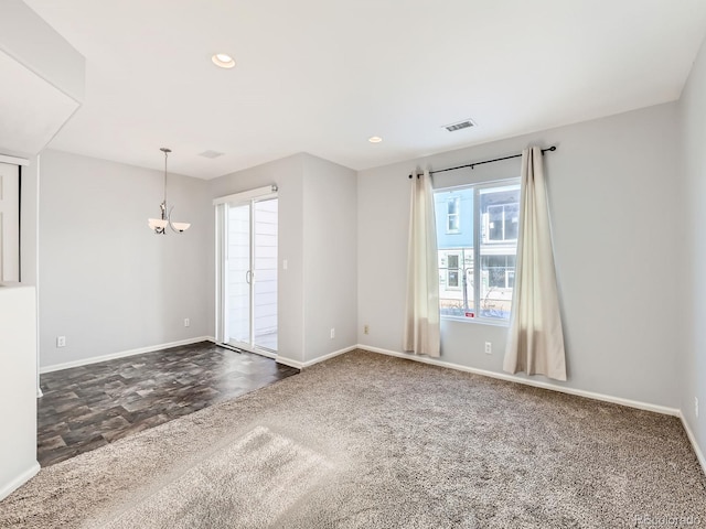 5888 Biscay St Unit D, Denver, CO 80249 - unfurnished room with baseboards, a chandelier, dark colored carpet, and recessed lighting