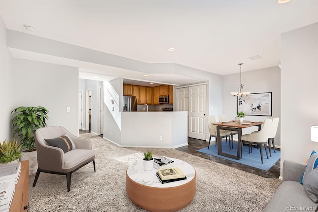 5888 Biscay St Unit D, Denver, CO 80249 - living room featuring a chandelier, recessed lighting, and baseboards