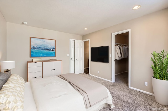 5888 Biscay St Unit D, Denver, CO 80249 - bedroom with carpet floors, baseboards, a spacious closet, and recessed lighting