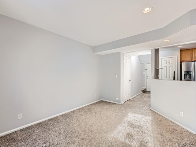 5888 Biscay St Unit D, Denver, CO 80249 - unfurnished living room featuring baseboards, light carpet, and recessed lighting