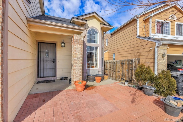 doorway to property with a patio