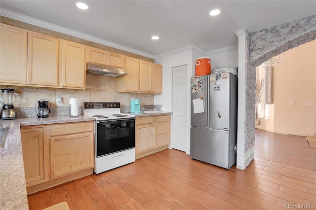 kitchen with range with electric cooktop, stainless steel fridge, light hardwood / wood-style floors, and light brown cabinets