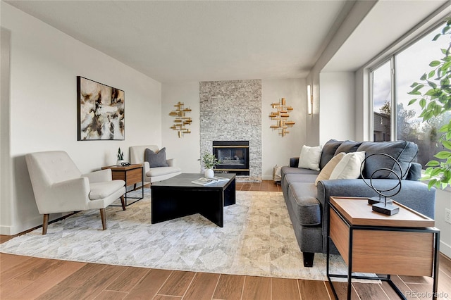 21455 E 44th Ave, Denver, CO 80249 - living room with baseboards, a fireplace, and wood finished floors