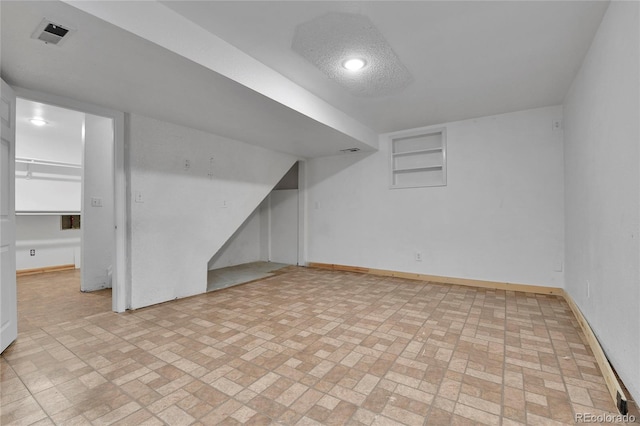 21455 E 44th Ave, Denver, CO 80249 - finished below grade area with baseboards and brick patterned floor