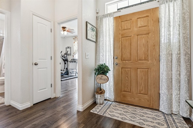 4293 Clover Ln, Brighton, CO 80601 - entryway featuring baseboards and dark wood-type flooring