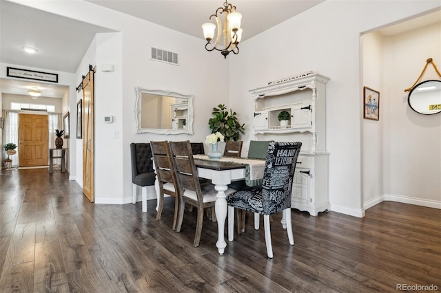 4293 Clover Ln, Brighton, CO 80601 - dining area featuring dark wood-style flooring, a chandelier, baseboards, and a barn door