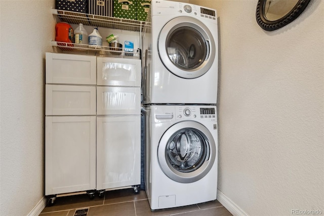 4293 Clover Ln, Brighton, CO 80601 - clothes washing area featuring stacked washer / drying machine and baseboards
