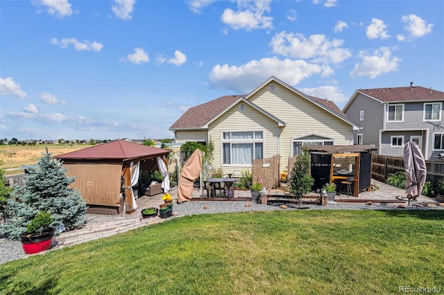 4293 Clover Ln, Brighton, CO 80601 - back of house with a gazebo, a patio, and a wooden deck